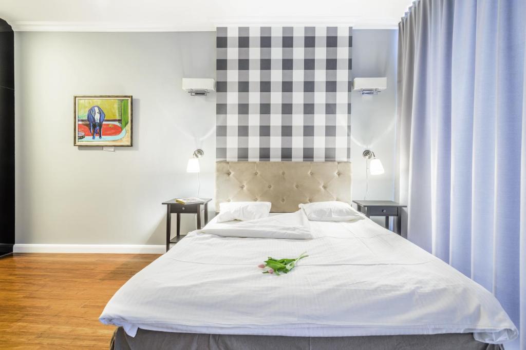 Posteľ alebo postele v izbe v ubytovaní Triton Park Apartments