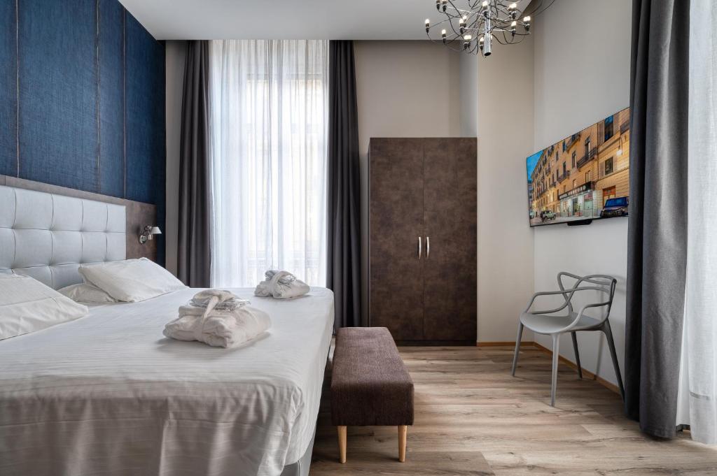Llit o llits en una habitació de Hotel Concord