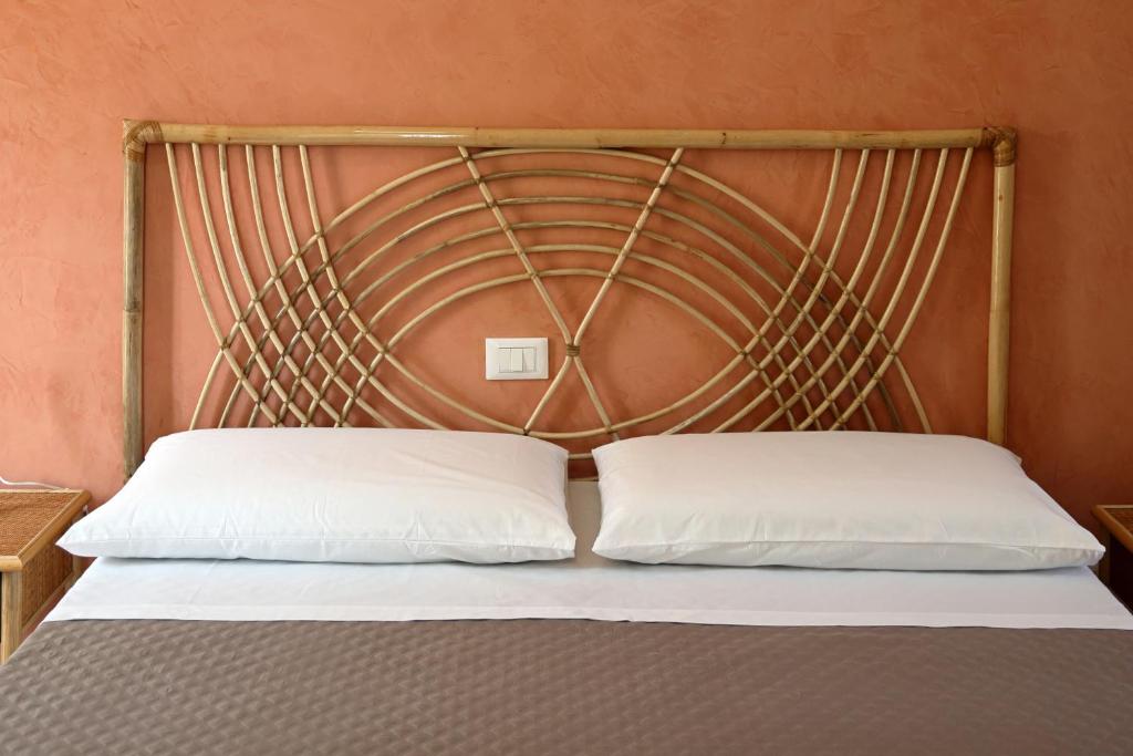Postel nebo postele na pokoji v ubytování Hotel della Piazza