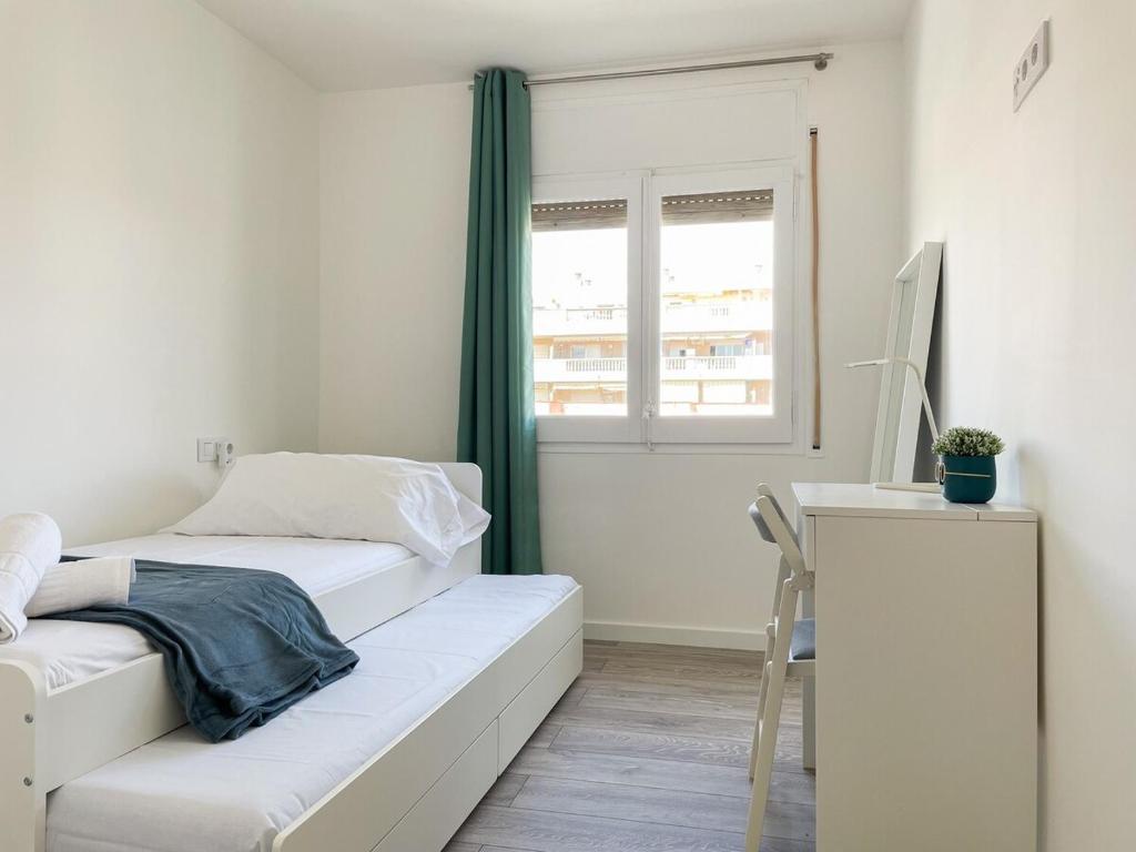 Postel nebo postele na pokoji v ubytování Palm Beach by Unik Tarragona