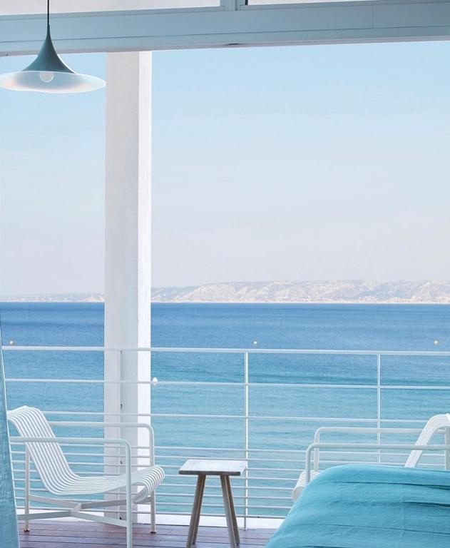 a bedroom with a view of the ocean at Les Bords De Mer in Marseille