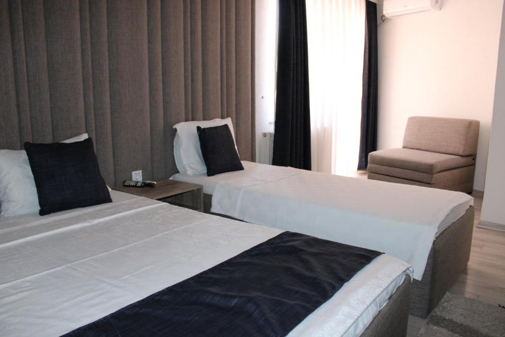 Postel nebo postele na pokoji v ubytování Hotel Cleon