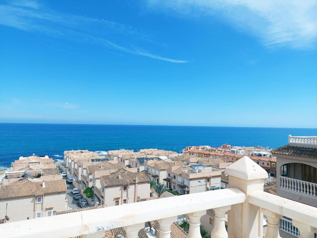 a view of a city from a balcony at AGAMARI La Mata Torrevieja sun apartment in Torrevieja