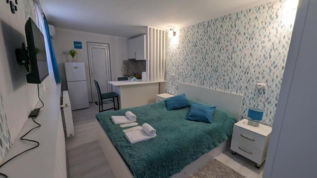 TV a/nebo společenská místnost v ubytování White Orchid