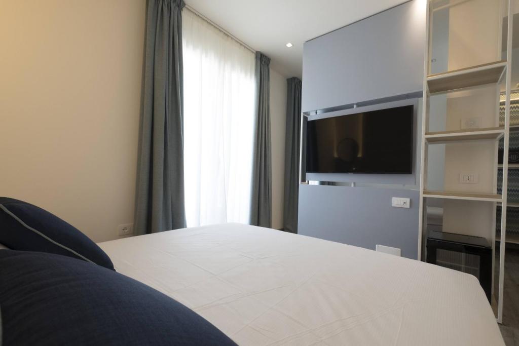 Postel nebo postele na pokoji v ubytování Hotel Baia