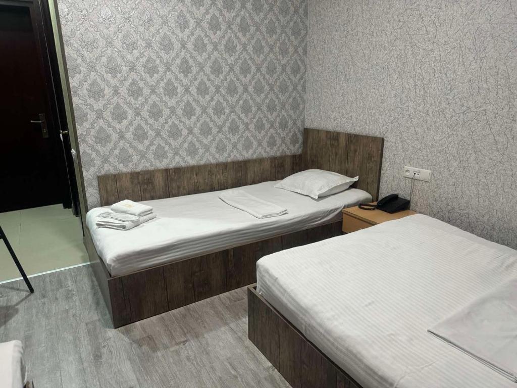 Postel nebo postele na pokoji v ubytování Hotel Skib
