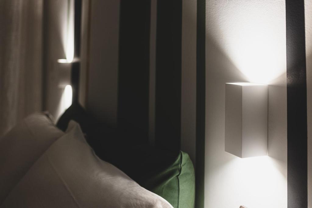 Postel nebo postele na pokoji v ubytování Piazza Verdi B&B