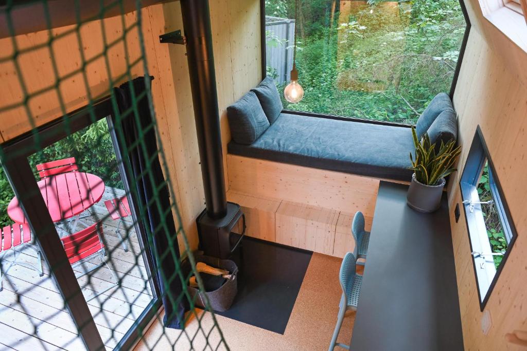 an aerial view of a tiny house with a fireplace at Green Tiny Village Harz - Tiny House Pioneer 10 in Osterode