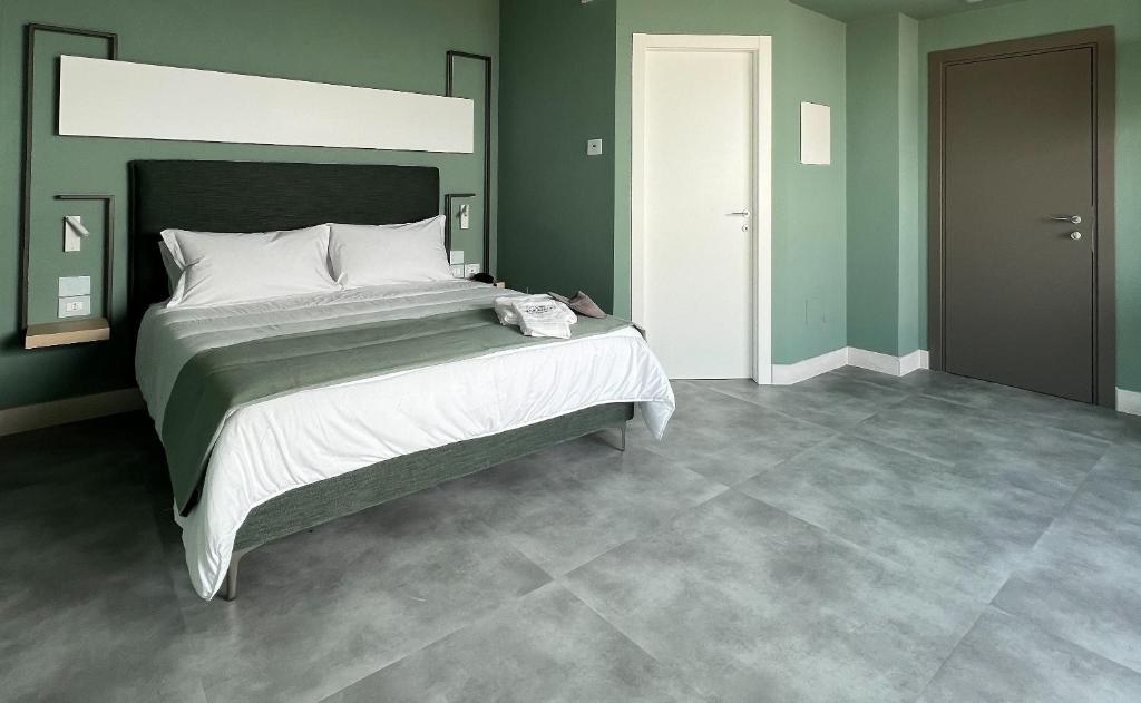 Postel nebo postele na pokoji v ubytování Maiorano Boutique Hotel