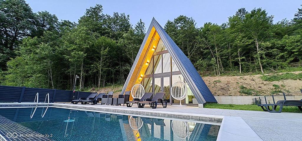 a pyramid shaped house with a swimming pool at UNA RESORT in Bosanska Krupa