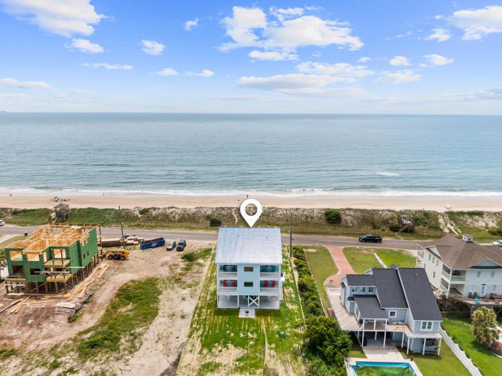 an aerial view of a house and the beach at Dune Our Thing North Topsail Beach in North Topsail Beach