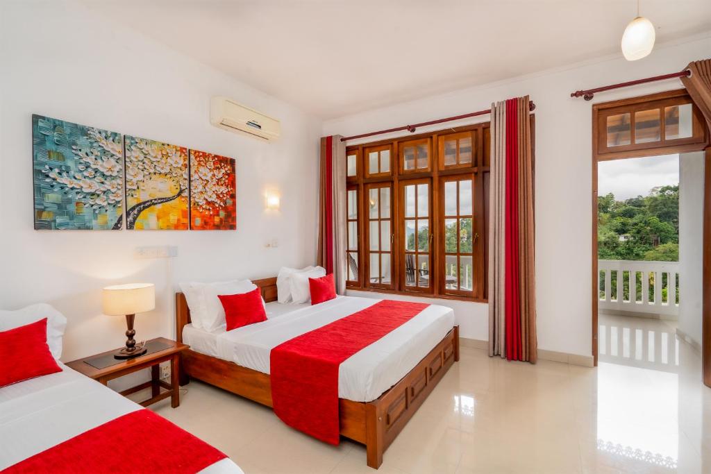 Postel nebo postele na pokoji v ubytování Kandy City Oasis Hotel