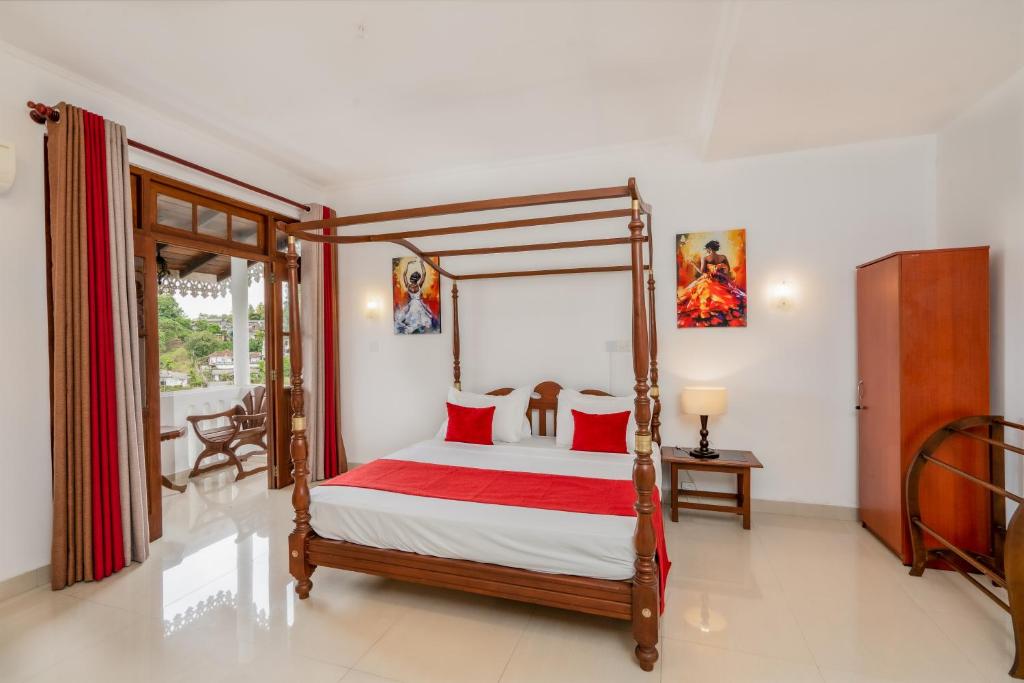 Postel nebo postele na pokoji v ubytování Kandy City Oasis Hotel