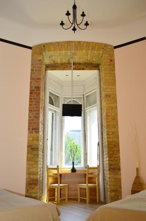Posteľ alebo postele v izbe v ubytovaní Centrooms House
