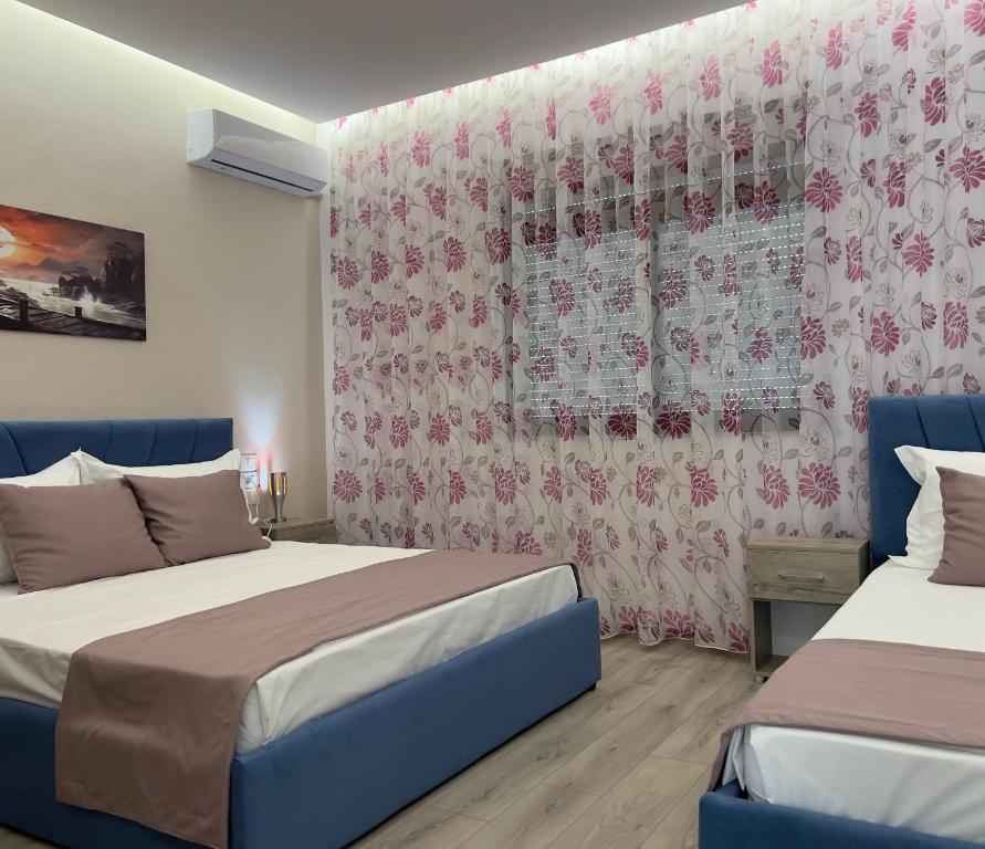Postel nebo postele na pokoji v ubytování Coral Home