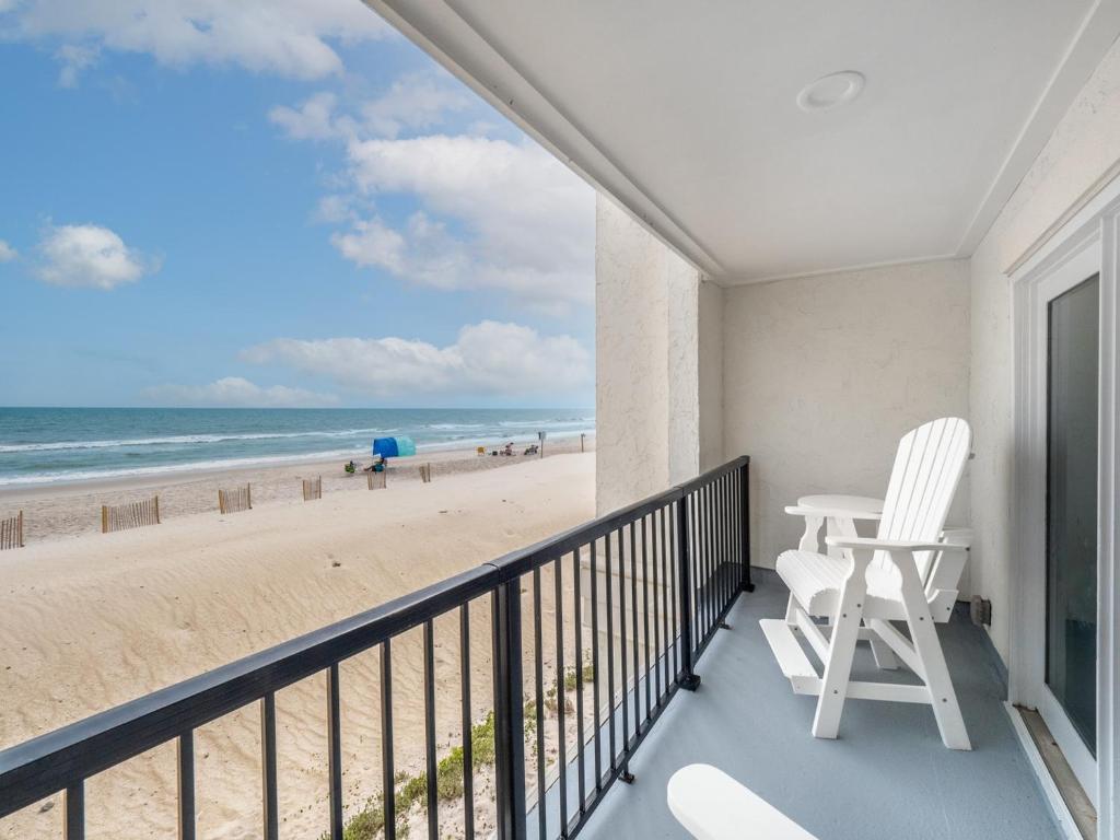 a balcony with a view of the beach at Love & Memories in North Topsail Beach