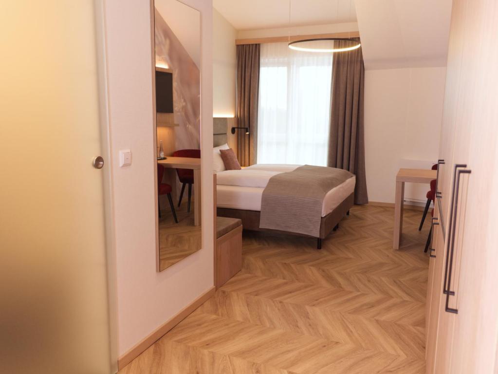 Postel nebo postele na pokoji v ubytování Hotel Wübbel