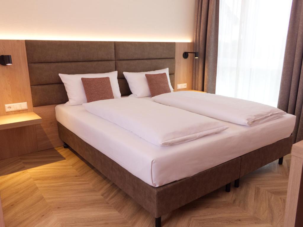 Postel nebo postele na pokoji v ubytování Hotel Wübbel