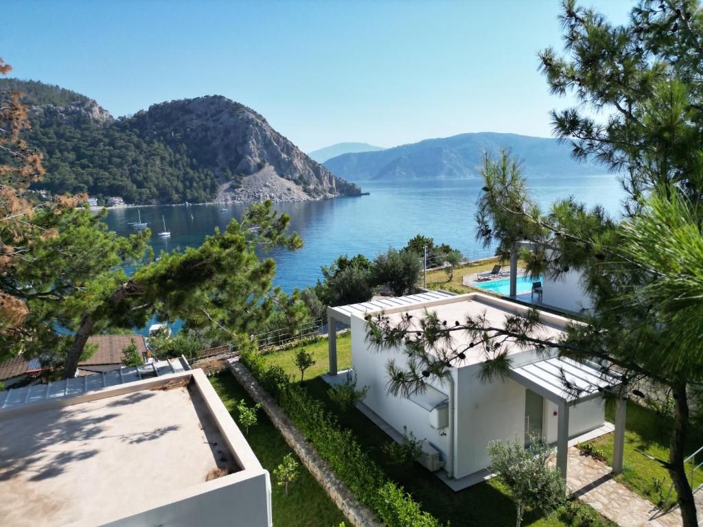 a house with a view of the water at Z-Villas Beach Hotel in Marmaris