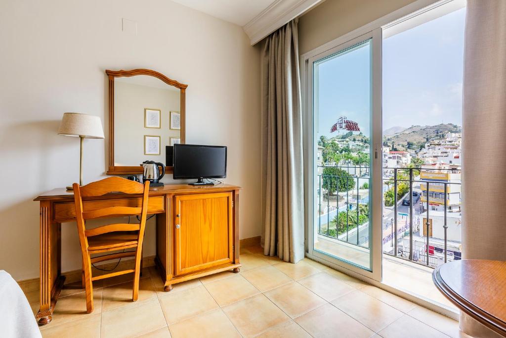 TV a/nebo společenská místnost v ubytování Hotel Almijara - Mares