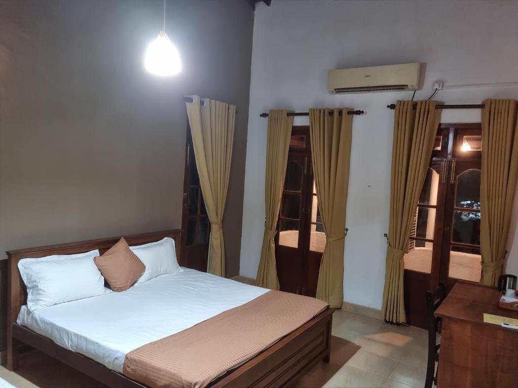 Postel nebo postele na pokoji v ubytování Stellar Inn
