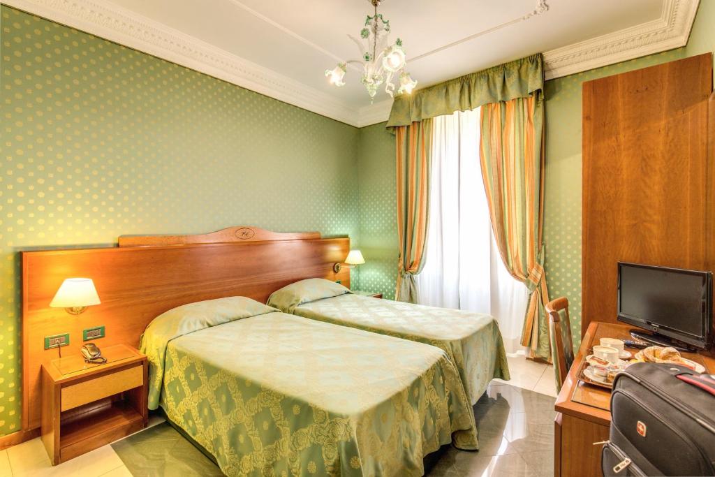 Postel nebo postele na pokoji v ubytování Hotel Contilia