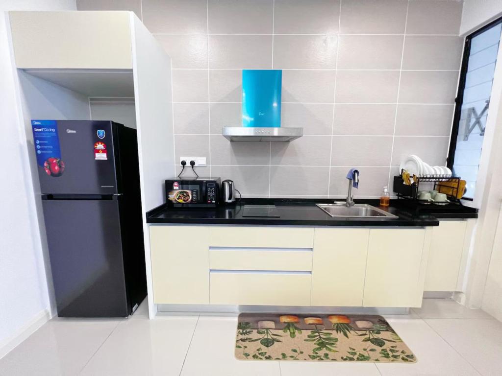 Kuchyň nebo kuchyňský kout v ubytování D'Pristine Medini Johor Bahru
