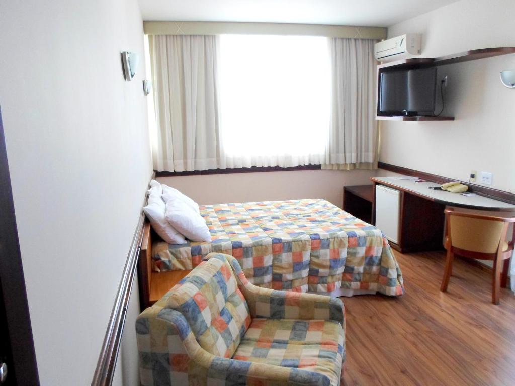TV a/nebo společenská místnost v ubytování Atalaia Palace Hotel
