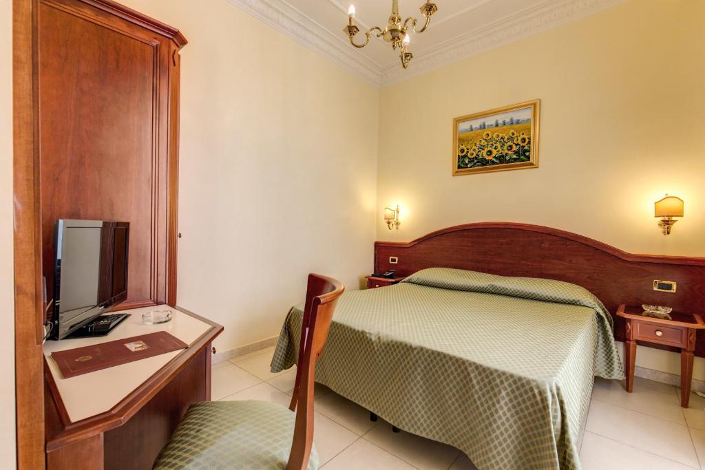 Postel nebo postele na pokoji v ubytování Hotel Contilia