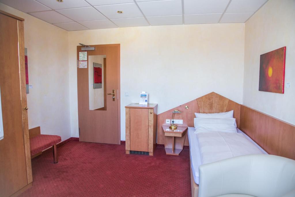 Postel nebo postele na pokoji v ubytování Hotel Heide Residenz