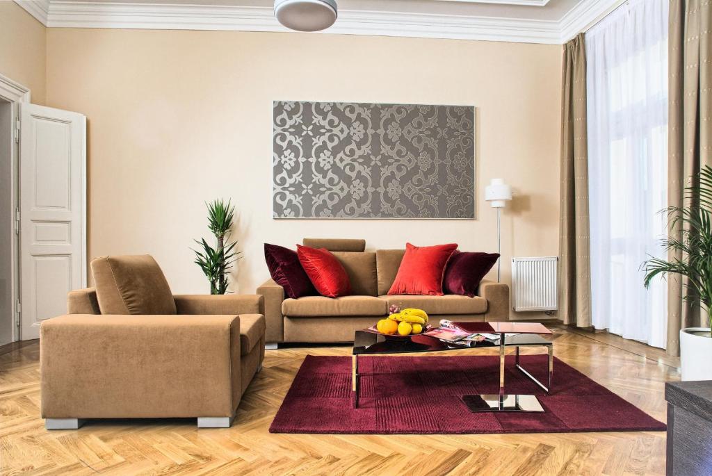 a living room with a couch and a table at Residence Karolina in Prague