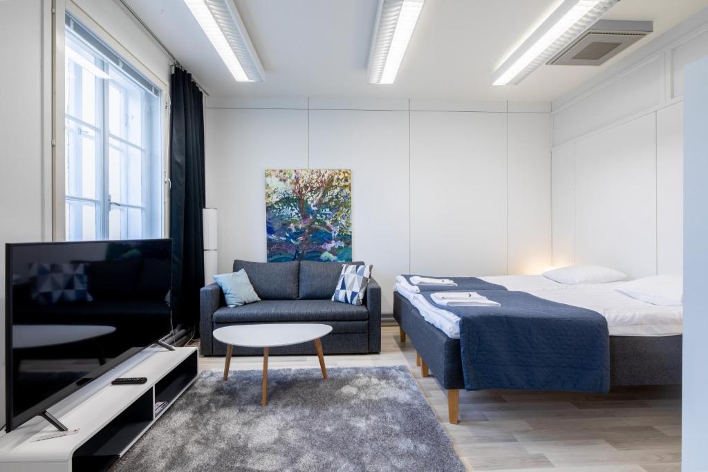 Postel nebo postele na pokoji v ubytování Tyylikäs City studio, Terassi ja ilmainen parkki Vanha Postitalo