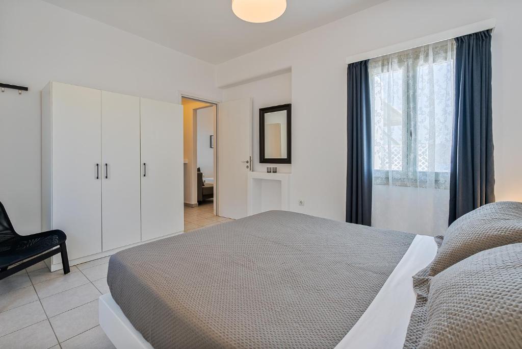 Postel nebo postele na pokoji v ubytování Lagadia Village