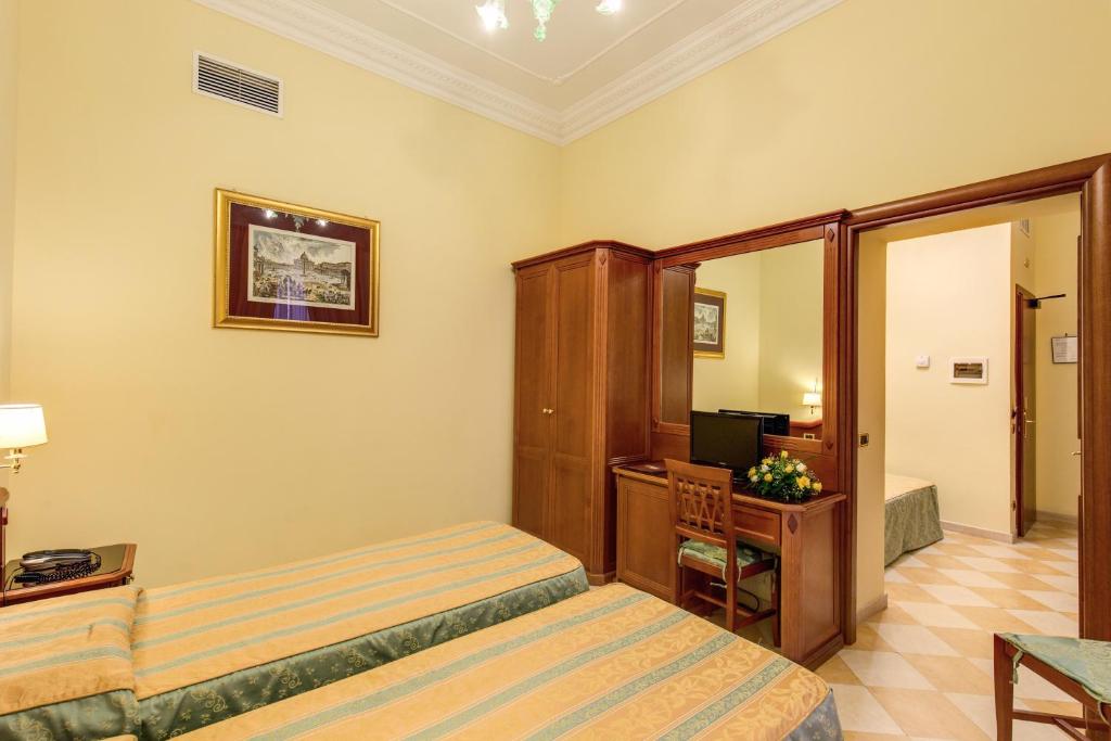 Postel nebo postele na pokoji v ubytování Hotel Contilia
