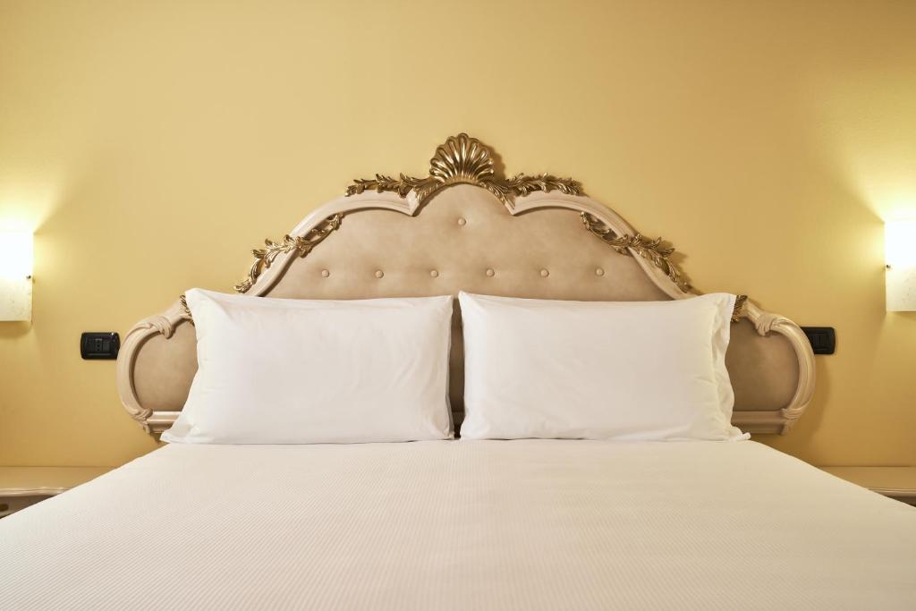 Postel nebo postele na pokoji v ubytování Albergo Antica Corte Marchesini