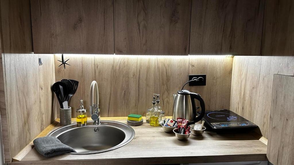 Kuchyň nebo kuchyňský kout v ubytování Cosy Studio Loft