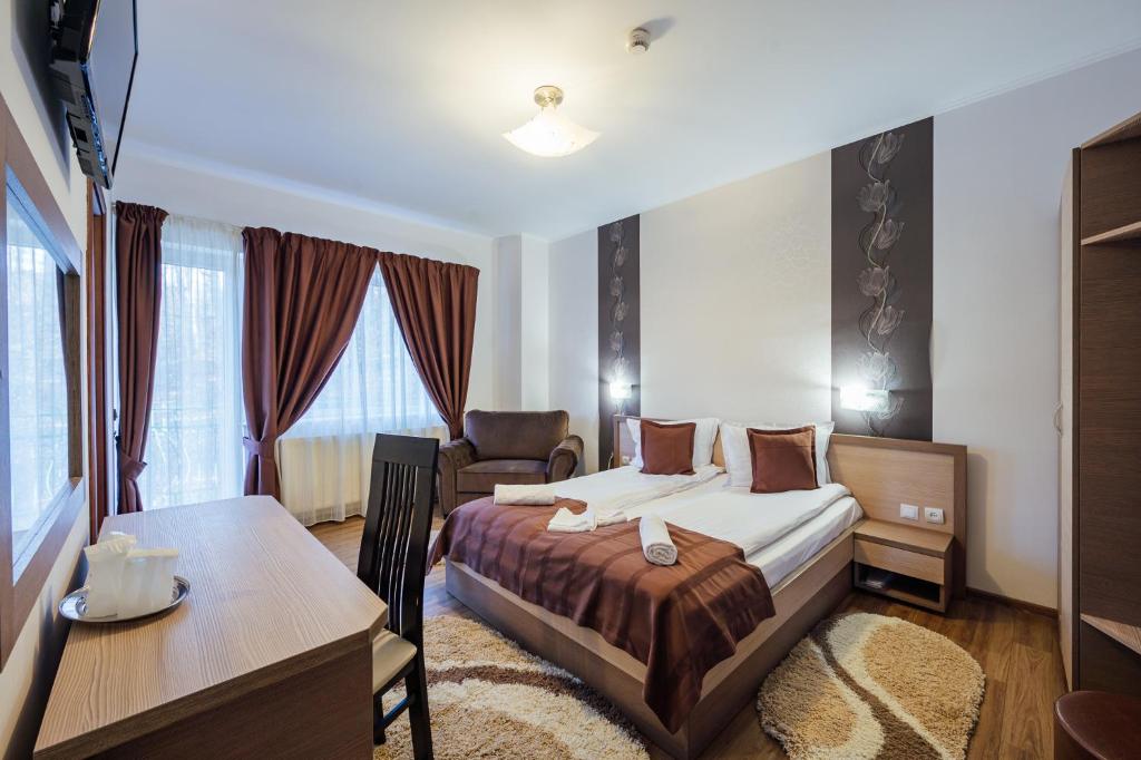 Postel nebo postele na pokoji v ubytování Szandy