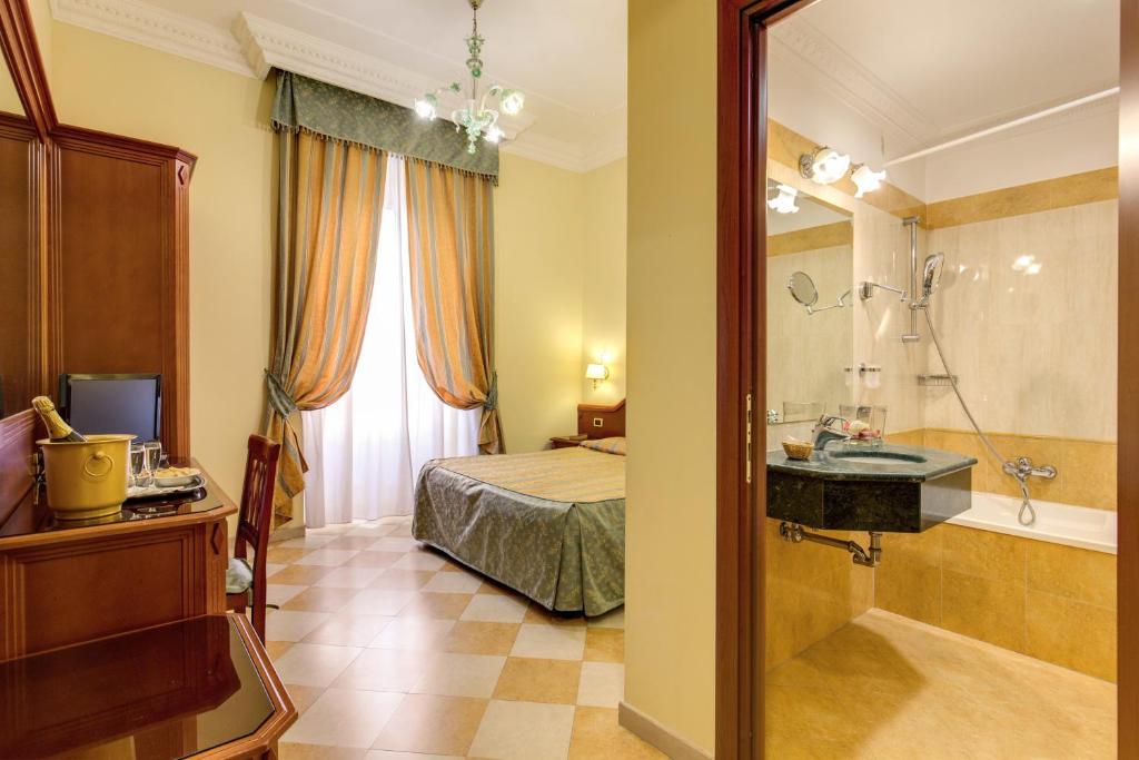 Postel nebo postele na pokoji v ubytování Hotel Contilia