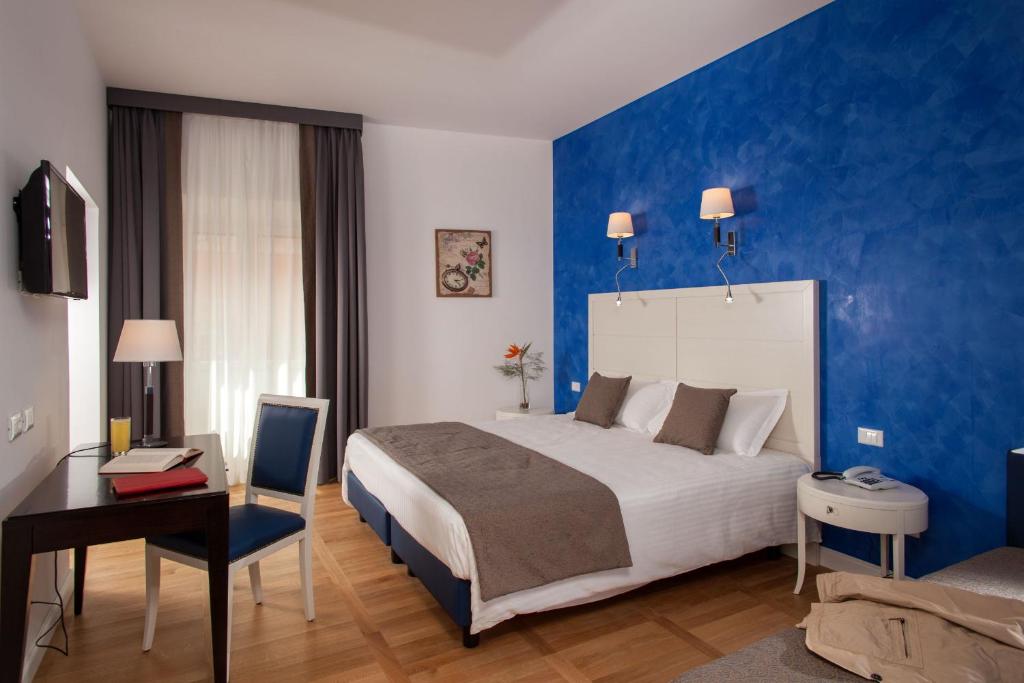 Postel nebo postele na pokoji v ubytování Floris Hotel