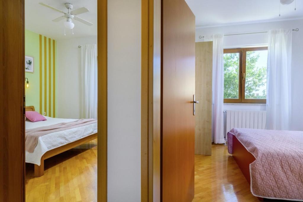 Posteľ alebo postele v izbe v ubytovaní Istria Rosa in Pula - Istrien