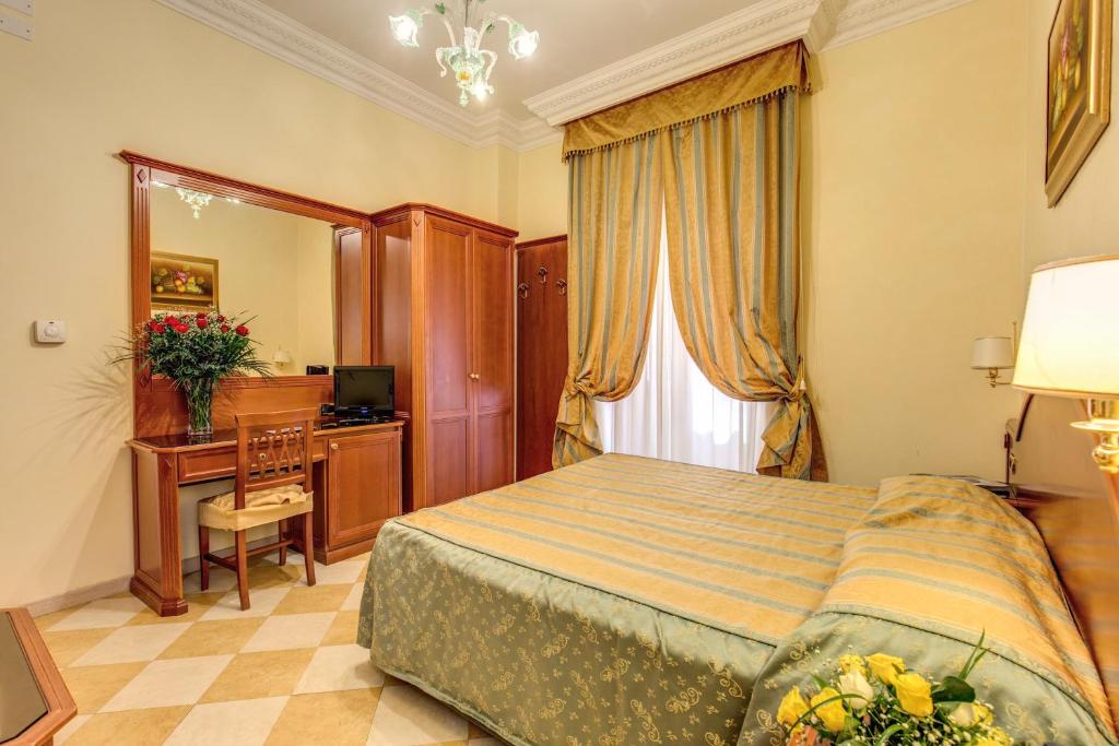 Postel nebo postele na pokoji v ubytování Hotel Contilia