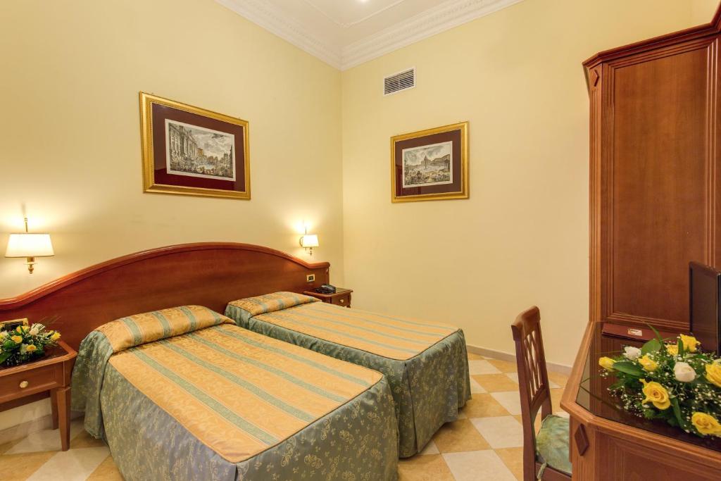 Postel nebo postele na pokoji v ubytování Hotel Contilia