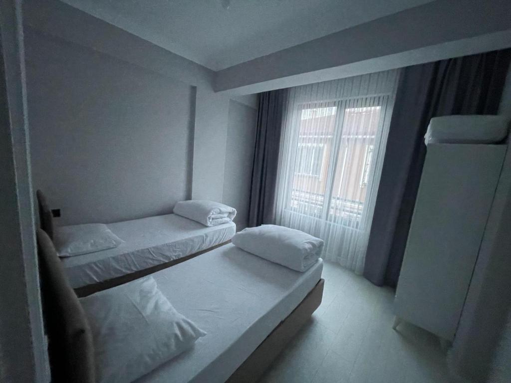 Postel nebo postele na pokoji v ubytování Sarımeşe Havuzlu Villa