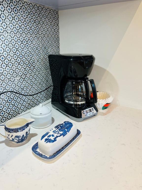 Příslušenství pro přípravu čaje a kávy v ubytování Maison du Havre Grand Duplex