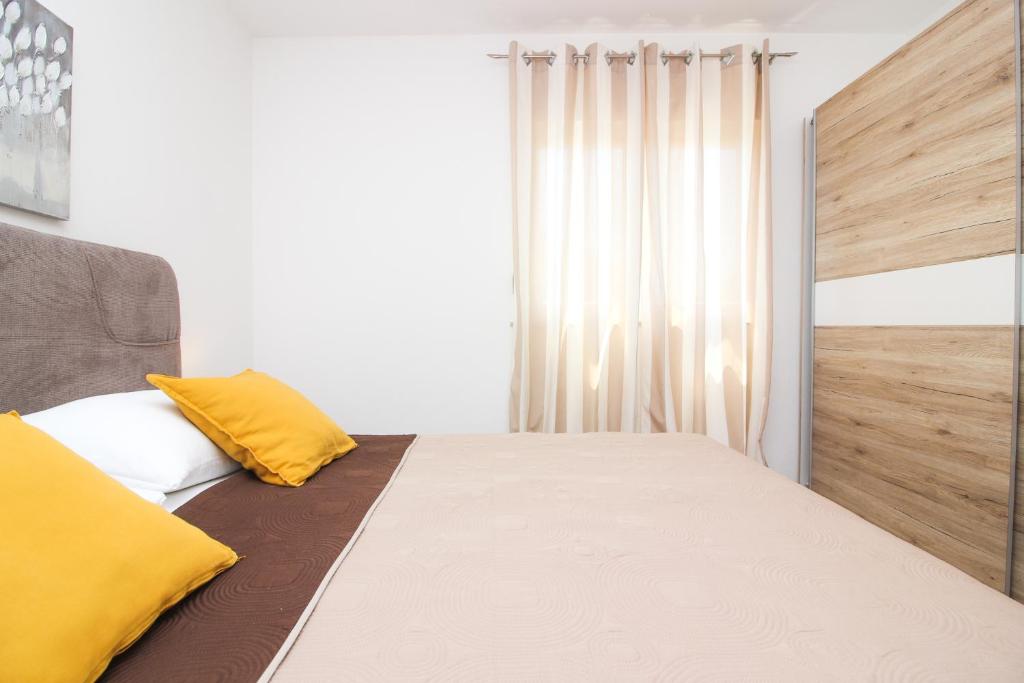 Posteľ alebo postele v izbe v ubytovaní Apartments Lotta