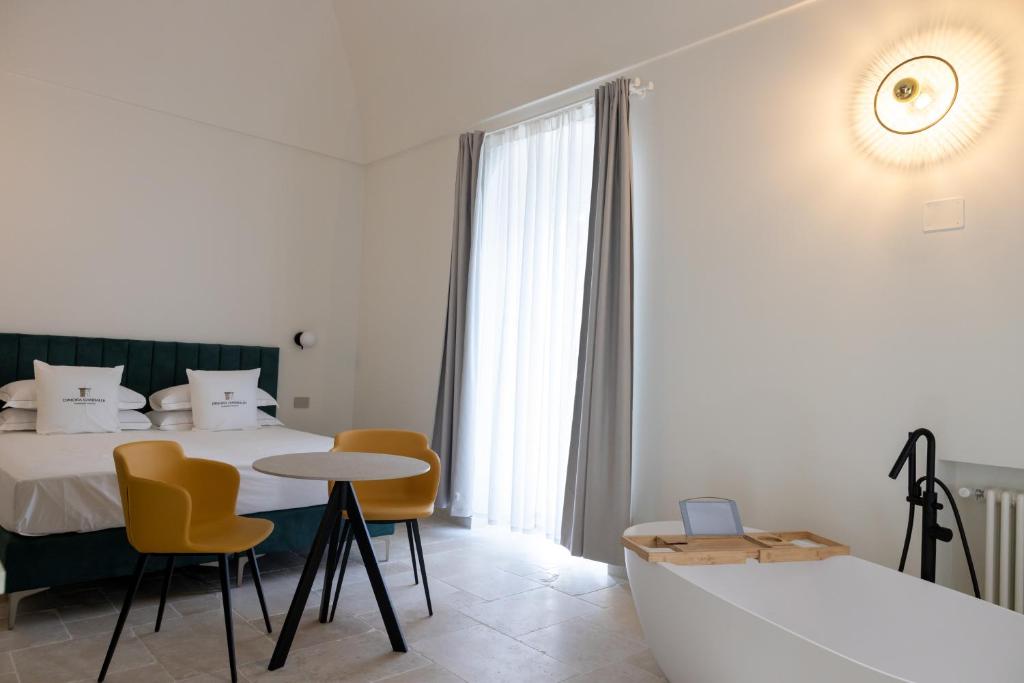 Postel nebo postele na pokoji v ubytování Suites Dimora Garibaldi