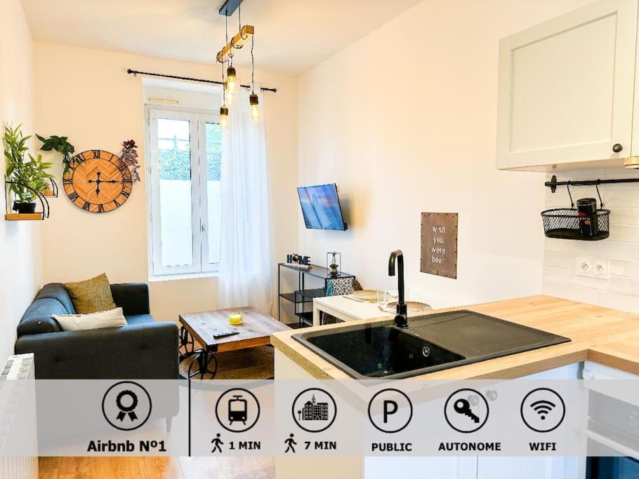 a kitchen with a sink and a living room at NEW Confort et Elégance Face à la GARE in Guingamp