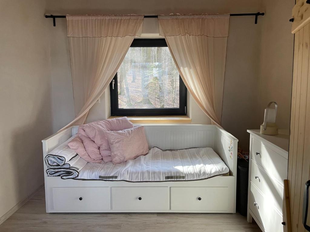 Ένα ή περισσότερα κρεβάτια σε δωμάτιο στο Apartmány Ľadovo