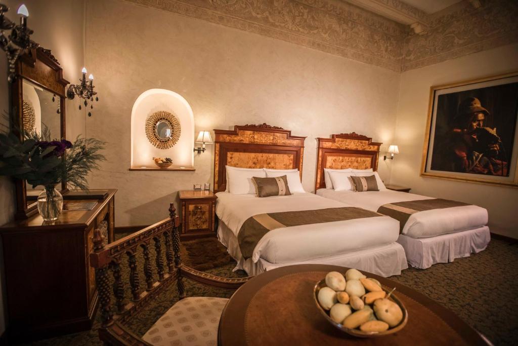 Postel nebo postele na pokoji v ubytování Aranwa Cusco Boutique Hotel