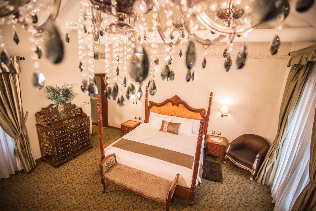 Postel nebo postele na pokoji v ubytování Aranwa Cusco Boutique Hotel